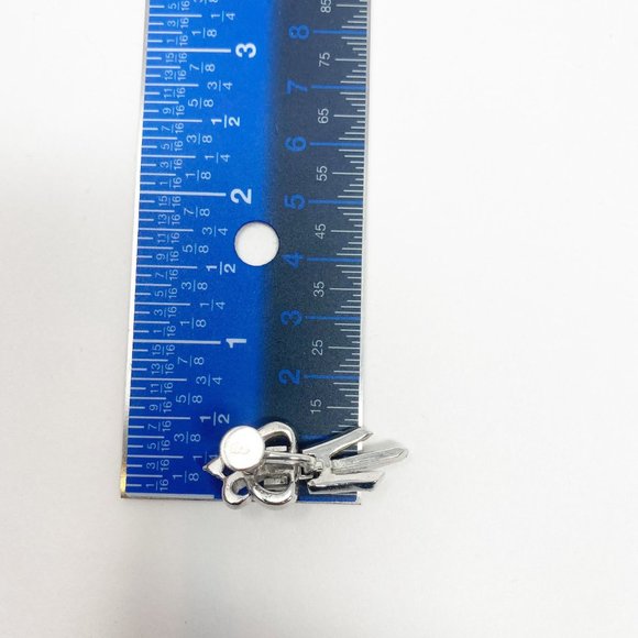 452 Three vintage Coro screw-back earrings